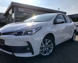 Front view of a rental Toyota Corolla in Prague, Czechia ✓ Car #612. ✓ Automatic TM ✓ 0 reviews.