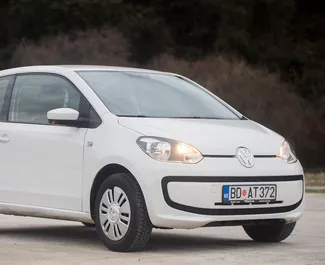 Front view of a rental Volkswagen Up in Budva, Montenegro ✓ Car #1048. ✓ Manual TM ✓ 2 reviews.