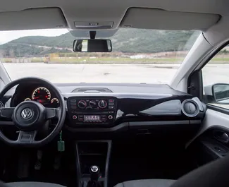Interior of Volkswagen Up for hire in Montenegro. A Great 4-seater car with a Manual transmission.