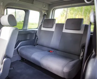 Interior of Volkswagen Caddy Maxi for hire in Montenegro. A Great 7-seater car with a Automatic transmission.