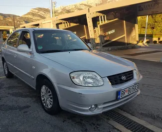 Front view of a rental Hyundai Accent in Bar, Montenegro ✓ Car #1219. ✓ Automatic TM ✓ 20 reviews.