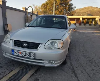 Hyundai Accent 2006 car hire in Montenegro, featuring ✓ Petrol fuel and 85 horsepower ➤ Starting from 16 EUR per day.
