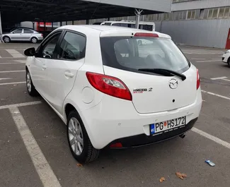 Mazda 2 2010 car hire in Montenegro, featuring ✓ Petrol fuel and 60 horsepower ➤ Starting from 30 EUR per day.