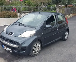 Front view of a rental Peugeot 107 in Bar, Montenegro ✓ Car #548. ✓ Automatic TM ✓ 16 reviews.