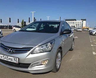 Front view of a rental Hyundai Solaris at Simferopol Airport, Crimea ✓ Car #1395. ✓ Automatic TM ✓ 1 reviews.