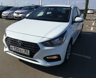 Front view of a rental Hyundai Solaris at Simferopol Airport, Crimea ✓ Car #1396. ✓ Automatic TM ✓ 1 reviews.