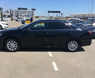 Petrol 2.0L engine of Toyota Camry 2016 for rental at Simferopol Airport.