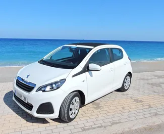 Front view of a rental Peugeot 108 Cabrio on Rhodes, Greece ✓ Car #1455. ✓ Automatic TM ✓ 0 reviews.