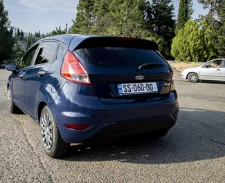 Petrol 1.3L engine of Ford Fiesta 2014 for rental in Tbilisi.
