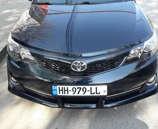 Front view of a rental Toyota Camry in Tbilisi, Georgia ✓ Car #1674. ✓ Automatic TM ✓ 0 reviews.