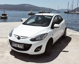 Front view of a rental Mazda 2 in Podgorica, Montenegro ✓ Car #939. ✓ Automatic TM ✓ 0 reviews.