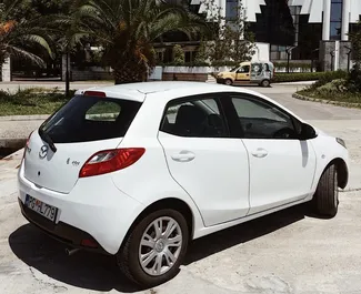 Mazda 2 2012 car hire in Montenegro, featuring ✓ Petrol fuel and 103 horsepower ➤ Starting from 10 EUR per day.