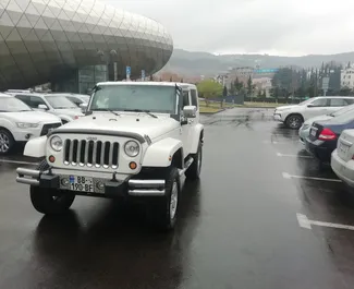 Front view of a rental Jeep Wrangler in Tbilisi, Georgia ✓ Car #1342. ✓ Automatic TM ✓ 0 reviews.