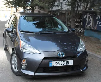 Front view of a rental Toyota Prius C in Tbilisi, Georgia ✓ Car #1810. ✓ Automatic TM ✓ 6 reviews.
