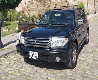 Front view of a rental Mitsubishi Pajero Io in Tbilisi, Georgia ✓ Car #1314. ✓ Automatic TM ✓ 14 reviews.