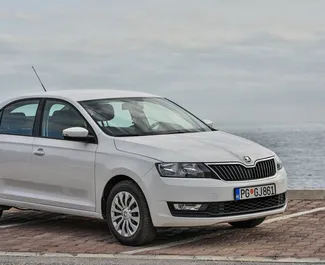 Front view of a rental Skoda Rapid in Budva, Montenegro ✓ Car #1267. ✓ Automatic TM ✓ 5 reviews.