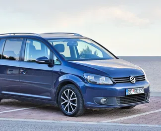 Front view of a rental Volkswagen Touran in Budva, Montenegro ✓ Car #1035. ✓ Automatic TM ✓ 7 reviews.