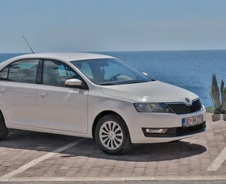 Front view of a rental Skoda Rapid in Budva, Montenegro ✓ Car #2043. ✓ Automatic TM ✓ 2 reviews.