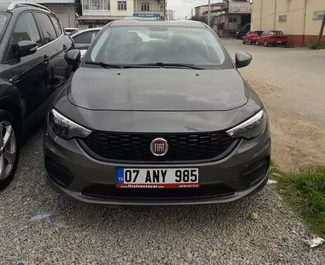 Front view of a rental Fiat Egea at Antalya Airport, Turkey ✓ Car #2161. ✓ Manual TM ✓ 0 reviews.