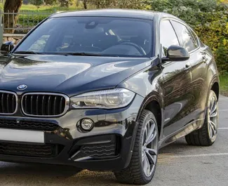 Front view of a rental BMW X6 in Becici, Montenegro ✓ Car #2492. ✓ Automatic TM ✓ 0 reviews.