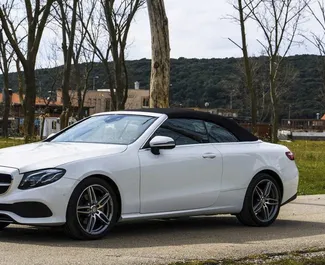 Front view of a rental Mercedes-Benz E-Class Cabrio in Becici, Montenegro ✓ Car #2477. ✓ Automatic TM ✓ 0 reviews.