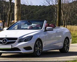 Front view of a rental Mercedes-Benz E-Class Cabrio in Becici, Montenegro ✓ Car #2478. ✓ Automatic TM ✓ 0 reviews.