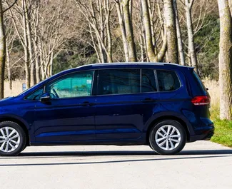Interior of Volkswagen Touran for hire in Montenegro. A Great 7-seater car with a Automatic transmission.
