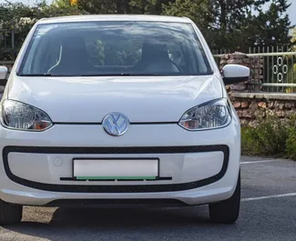 Front view of a rental Volkswagen Up in Becici, Montenegro ✓ Car #2461. ✓ Automatic TM ✓ 1 reviews.