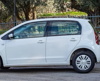 Volkswagen Up 2015 car hire in Montenegro, featuring ✓ Petrol fuel and 73 horsepower ➤ Starting from 28 EUR per day.