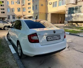 Skoda Rapid 2018 car hire in Crimea, featuring ✓ Petrol fuel and 110 horsepower ➤ Starting from 1416 RUB per day.