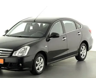 Front view of a rental Nissan Almera in Kerch, Crimea ✓ Car #2745. ✓ Automatic TM ✓ 0 reviews.