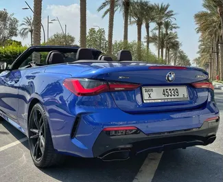 BMW M440i Cabrio 2021 car hire in the UAE, featuring ✓ Petrol fuel and 382 horsepower ➤ Starting from 852 AED per day.
