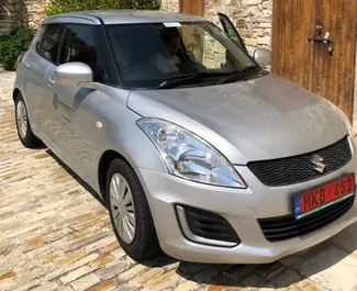 Front view of a rental Suzuki Swift in Paphos, Cyprus ✓ Car #3170. ✓ Automatic TM ✓ 0 reviews.