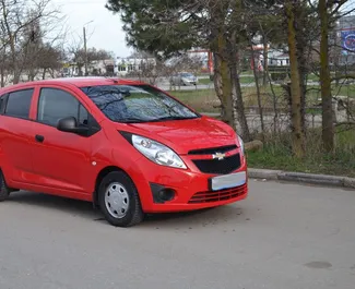 Front view of a rental Chevrolet Spark in Yevpatoriya, Crimea ✓ Car #3201. ✓ Automatic TM ✓ 0 reviews.