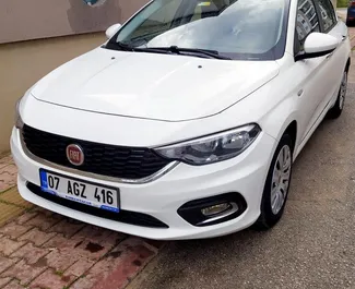 Front view of a rental Fiat Egea at Antalya Airport, Turkey ✓ Car #3875. ✓ Automatic TM ✓ 0 reviews.