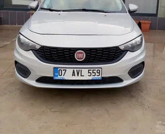 Front view of a rental Fiat Egea at Antalya Airport, Turkey ✓ Car #3874. ✓ Automatic TM ✓ 0 reviews.