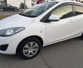 Mazda Demio 2014 available for rent in Larnaca, with unlimited mileage limit.