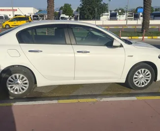 Front view of a rental Fiat Egea at Antalya Airport, Turkey ✓ Car #4222. ✓ Manual TM ✓ 8 reviews.