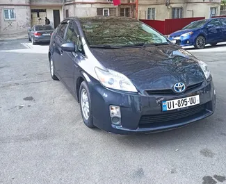 Front view of a rental Toyota Prius Hybrid in Tbilisi, Georgia ✓ Car #4232. ✓ Automatic TM ✓ 9 reviews.