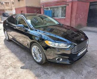 Front view of a rental Ford Fusion at Tbilisi Airport, Georgia ✓ Car #4184. ✓ Automatic TM ✓ 0 reviews.