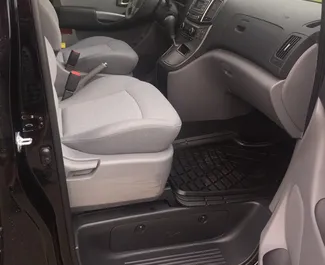 Interior of Hyundai H1 for hire in Georgia. A Great 8-seater car with a Automatic transmission.