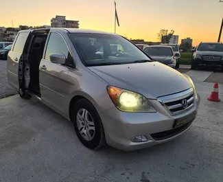 Front view of a rental Honda Odyssey at Tirana airport, Albania ✓ Car #4696. ✓ Automatic TM ✓ 1 reviews.