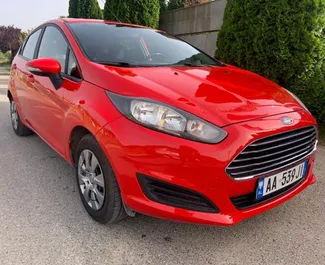 Front view of a rental Ford Fiesta in Tirana, Albania ✓ Car #4614. ✓ Manual TM ✓ 2 reviews.