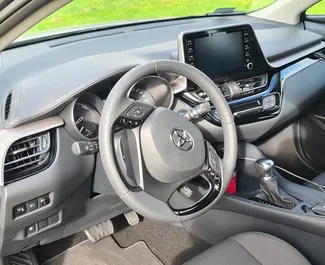 Toyota C-HR rental. Comfort, Crossover Car for Renting in Spain ✓ Deposit of 500 EUR ✓ TPL, CDW insurance options.