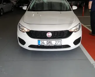 Front view of a rental Fiat Egea at Istanbul Sabiha Gokcen Airport, Turkey ✓ Car #4466. ✓ Automatic TM ✓ 0 reviews.