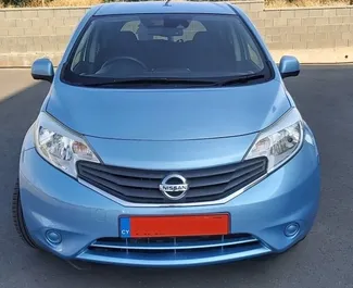 Front view of a rental Nissan Note at Paphos Airport, Cyprus ✓ Car #5022. ✓ Automatic TM ✓ 0 reviews.