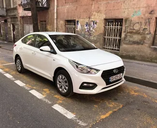 Front view of a rental Hyundai Accent in Tbilisi, Georgia ✓ Car #5441. ✓ Automatic TM ✓ 0 reviews.