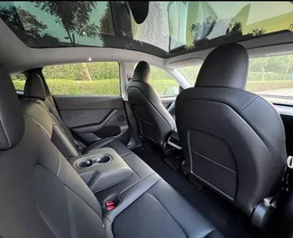 Interior of Tesla Model Y – Long Range for hire in the UAE. A Great 4-seater car with a Automatic transmission.