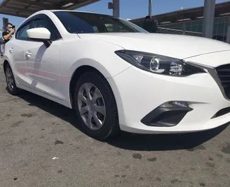 Mazda Axela 2015 car hire in Cyprus, featuring ✓ Petrol fuel and 60 horsepower ➤ Starting from 40 EUR per day.
