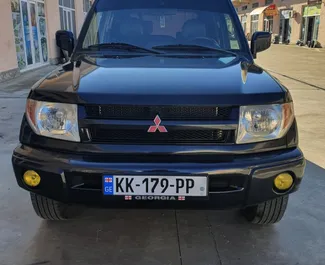 Front view of a rental Mitsubishi Pajero Io in Kutaisi, Georgia ✓ Car #3851. ✓ Manual TM ✓ 0 reviews.
